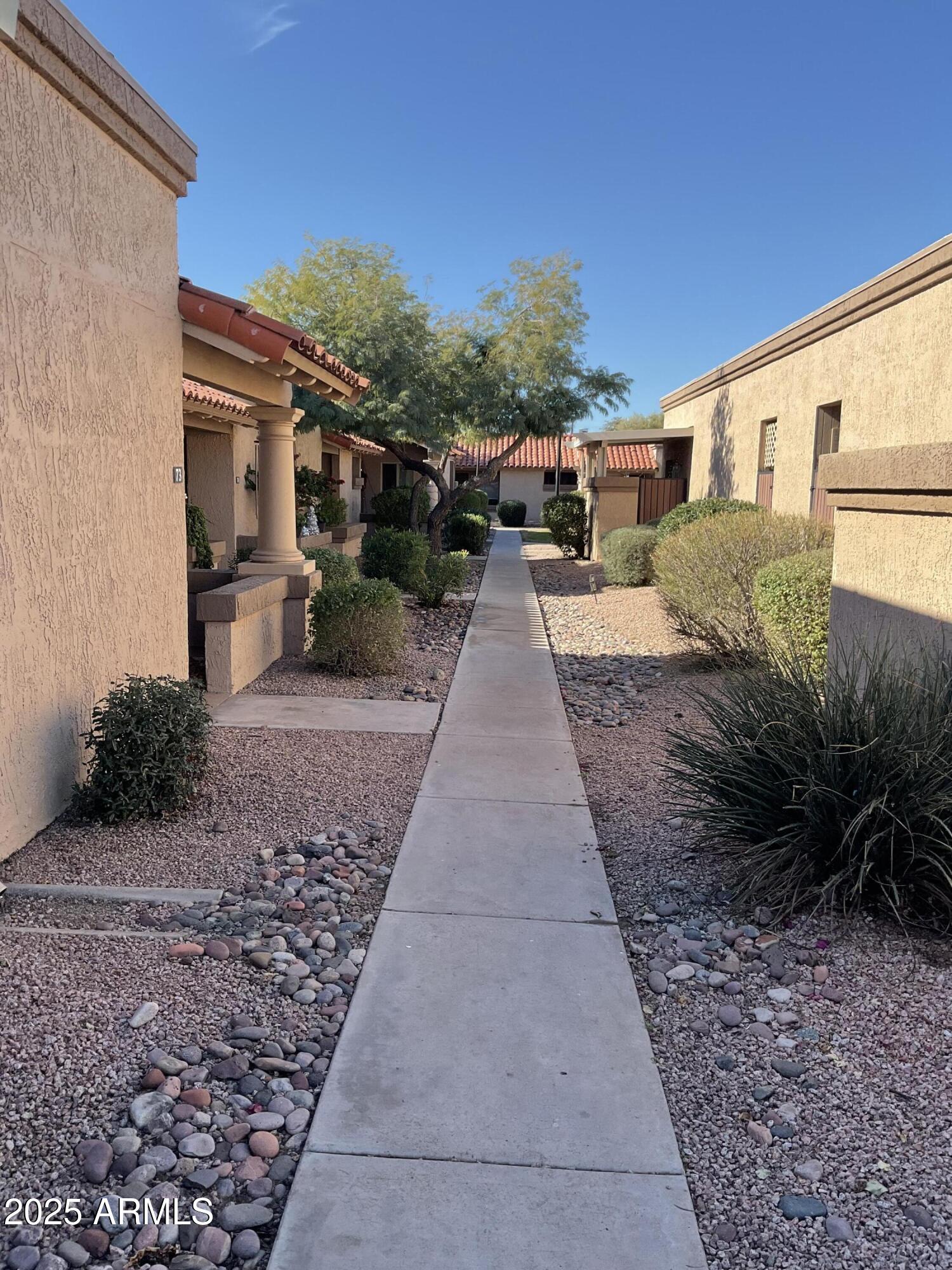 95 North Cooper Road, Unit 75 Chandler, AZ 85225 - Photo 19 of 19 a view of a back yard of the house