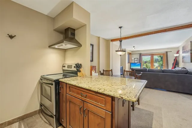a kitchen with a table and a stove