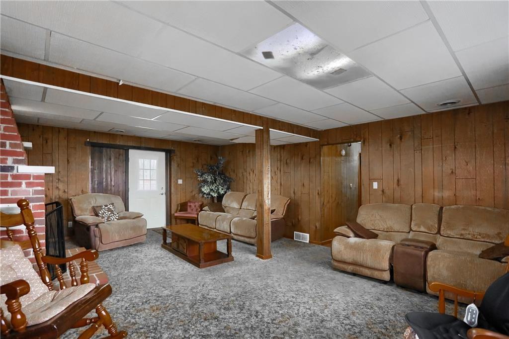 3305 State Road New Castle, PA 16105 - Photo 11 of 35 a living room with furniture and a flat screen tv