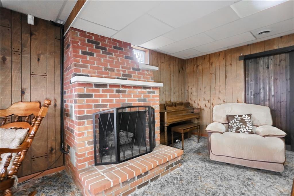 3305 State Road New Castle, PA 16105 - Photo 12 of 35 a living room with furniture and a fireplace