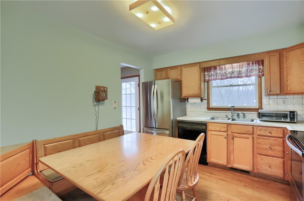 3305 State Road New Castle, PA 16105 - Photo 18 of 35 a kitchen with a stove a sink a dining table and chairs
