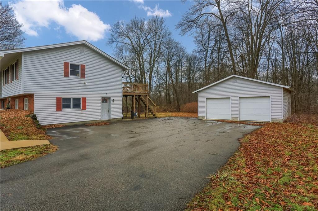3305 State Road New Castle, PA 16105 - Photo 2 of 35 a view of a house with a yard and garage
