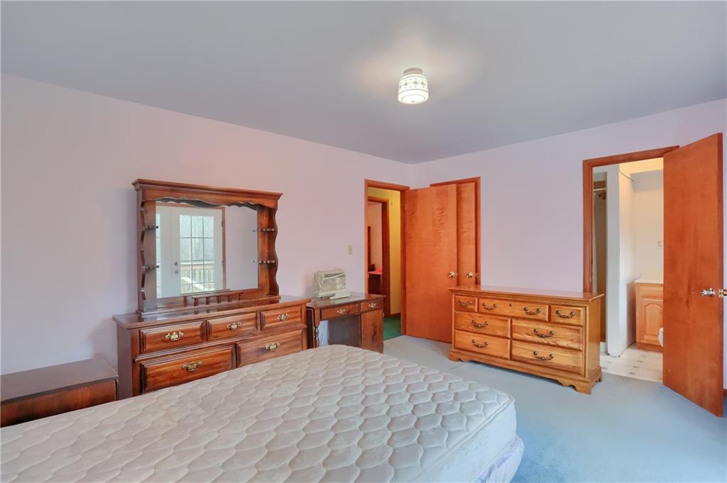 3305 State Road New Castle, PA 16105 - Photo 21 of 35 a bedroom with a bed and a dresser next to a window