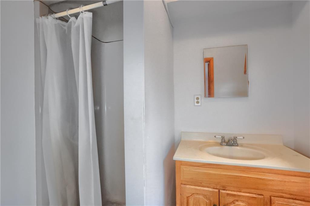3305 State Road New Castle, PA 16105 - Photo 23 of 35 a bathroom with a sink and a mirror