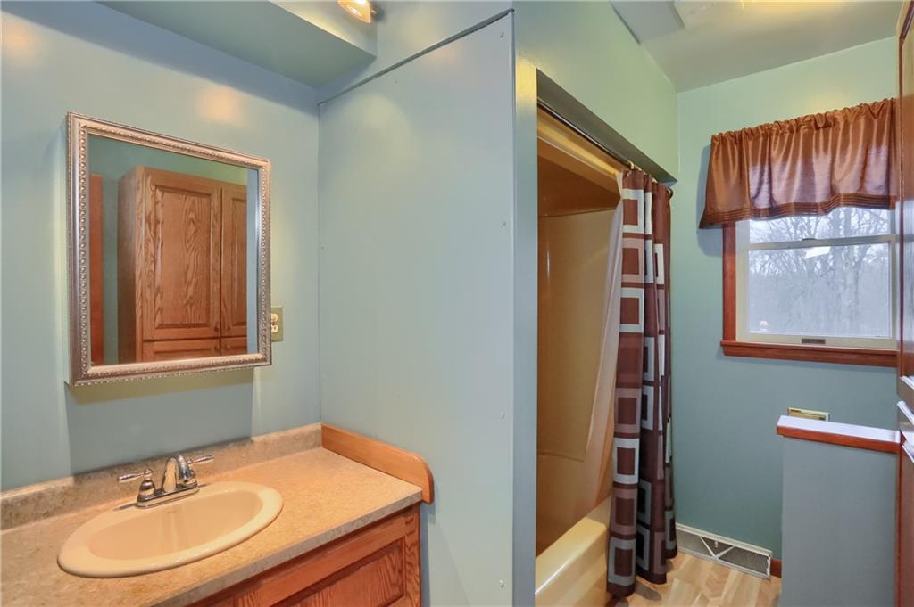 3305 State Road New Castle, PA 16105 - Photo 28 of 35 a bathroom with a sink a mirror and a window