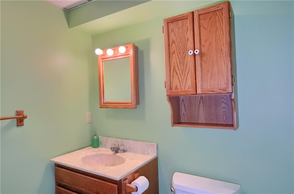 3305 State Road New Castle, PA 16105 - Photo 9 of 35 a bathroom with a sink a mirror and a toilet