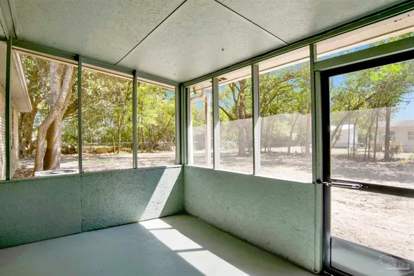 a view of an empty room with a large window