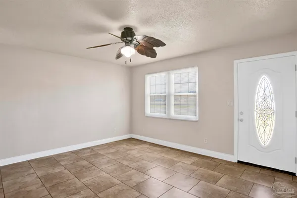 a view of an empty room with a window