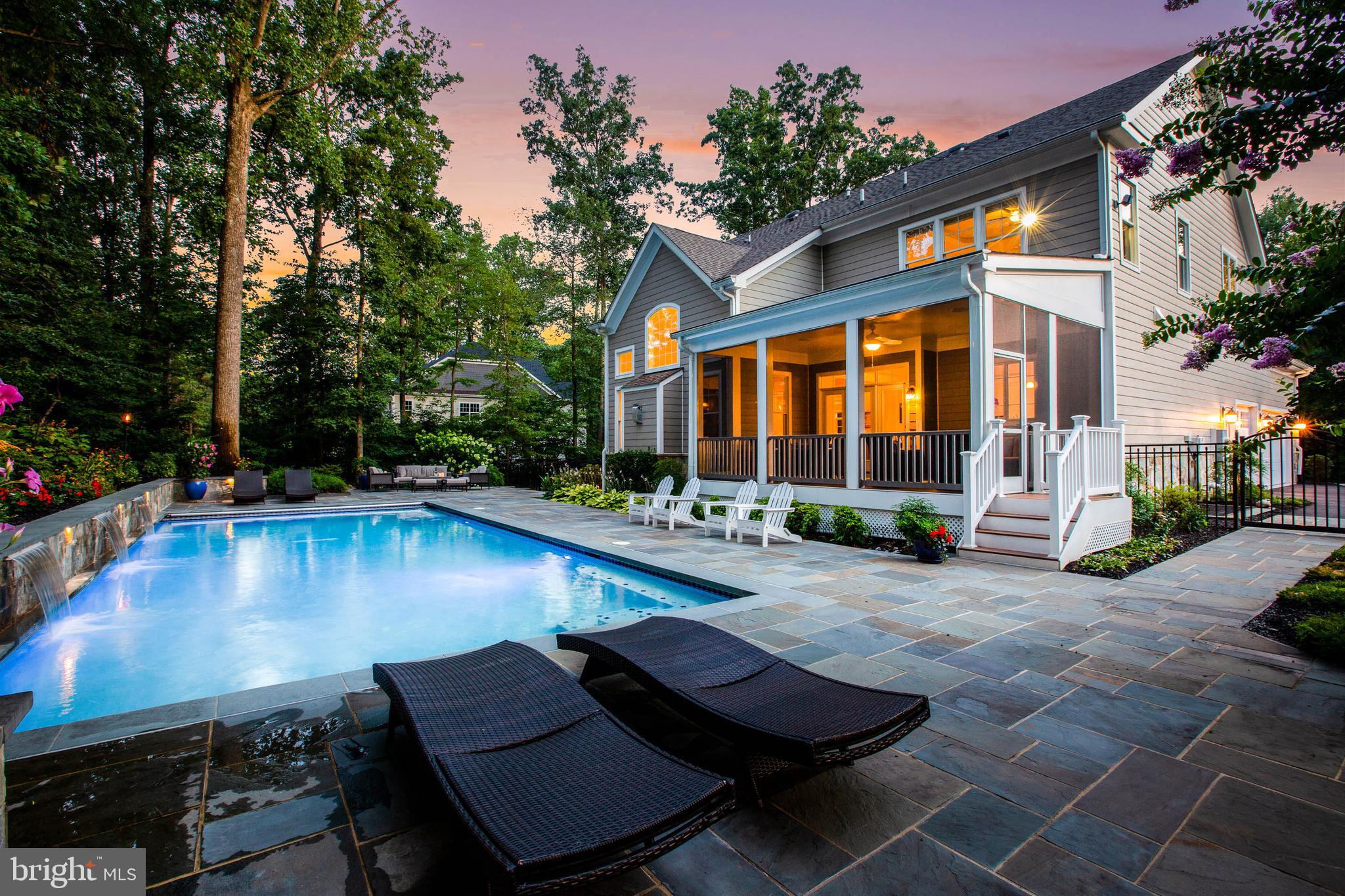 3003 Weber Place Oakton, VA 22124 - Photo 1 of 63 a view of a patio with swimming pool table and chairs