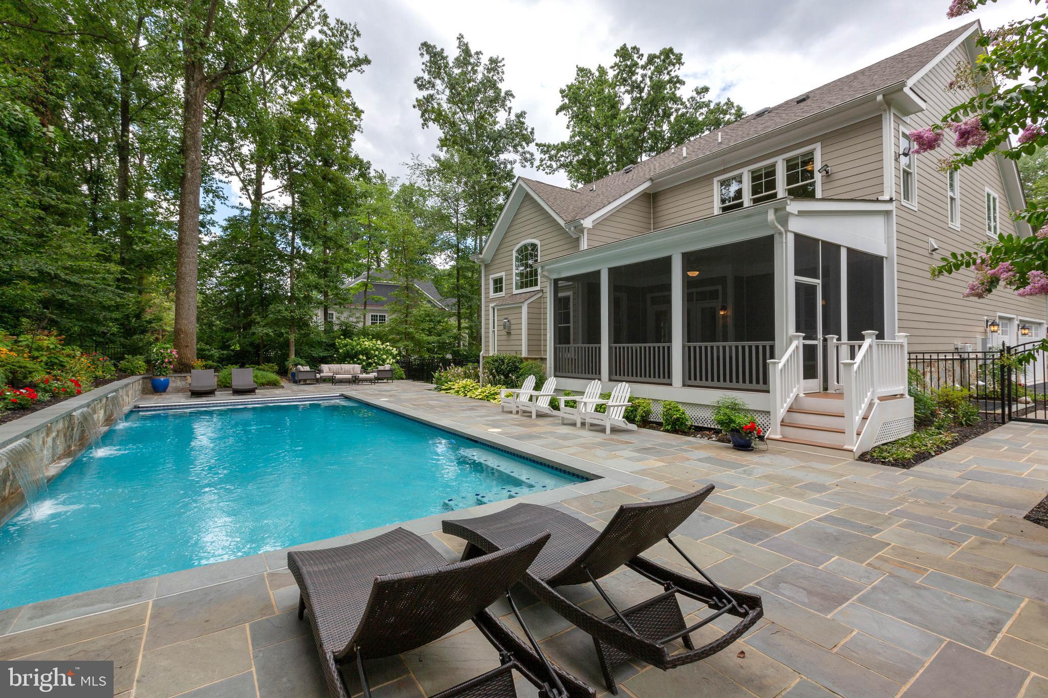 3003 Weber Place Oakton, VA 22124 - Photo 29 of 63 a view of a house with backyard sitting area and swimming pool