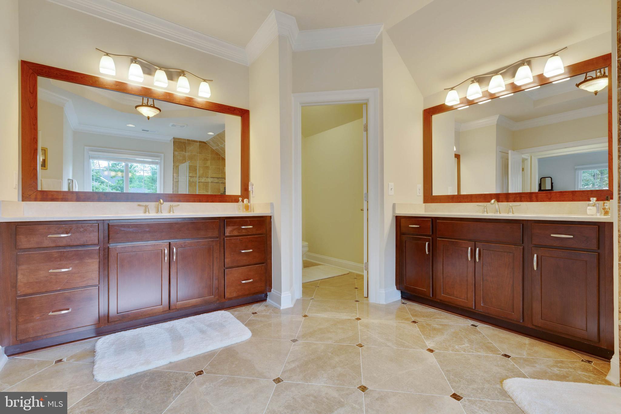 3003 Weber Place Oakton, VA 22124 - Photo 39 of 63 a spacious bathroom with a granite countertop sink and a mirror