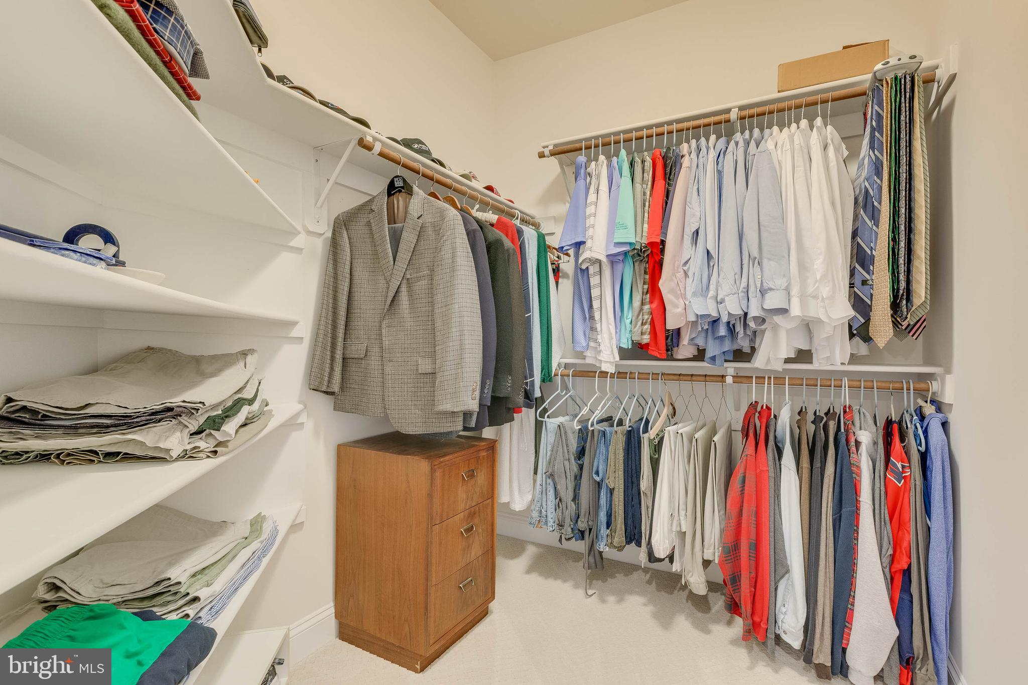 3003 Weber Place Oakton, VA 22124 - Photo 42 of 63 a view of walk in closet with clothes and shoes
