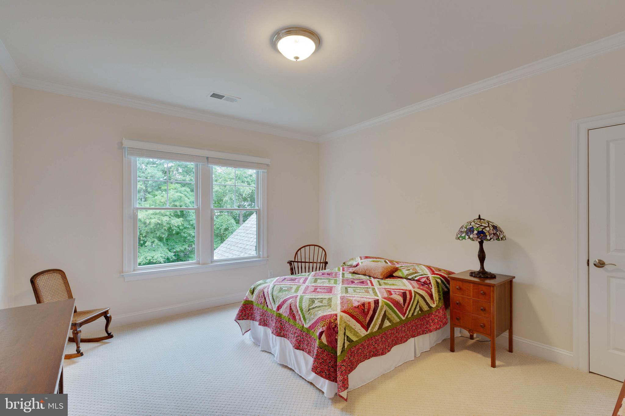3003 Weber Place Oakton, VA 22124 - Photo 46 of 63 a bedroom with a bed and a window
