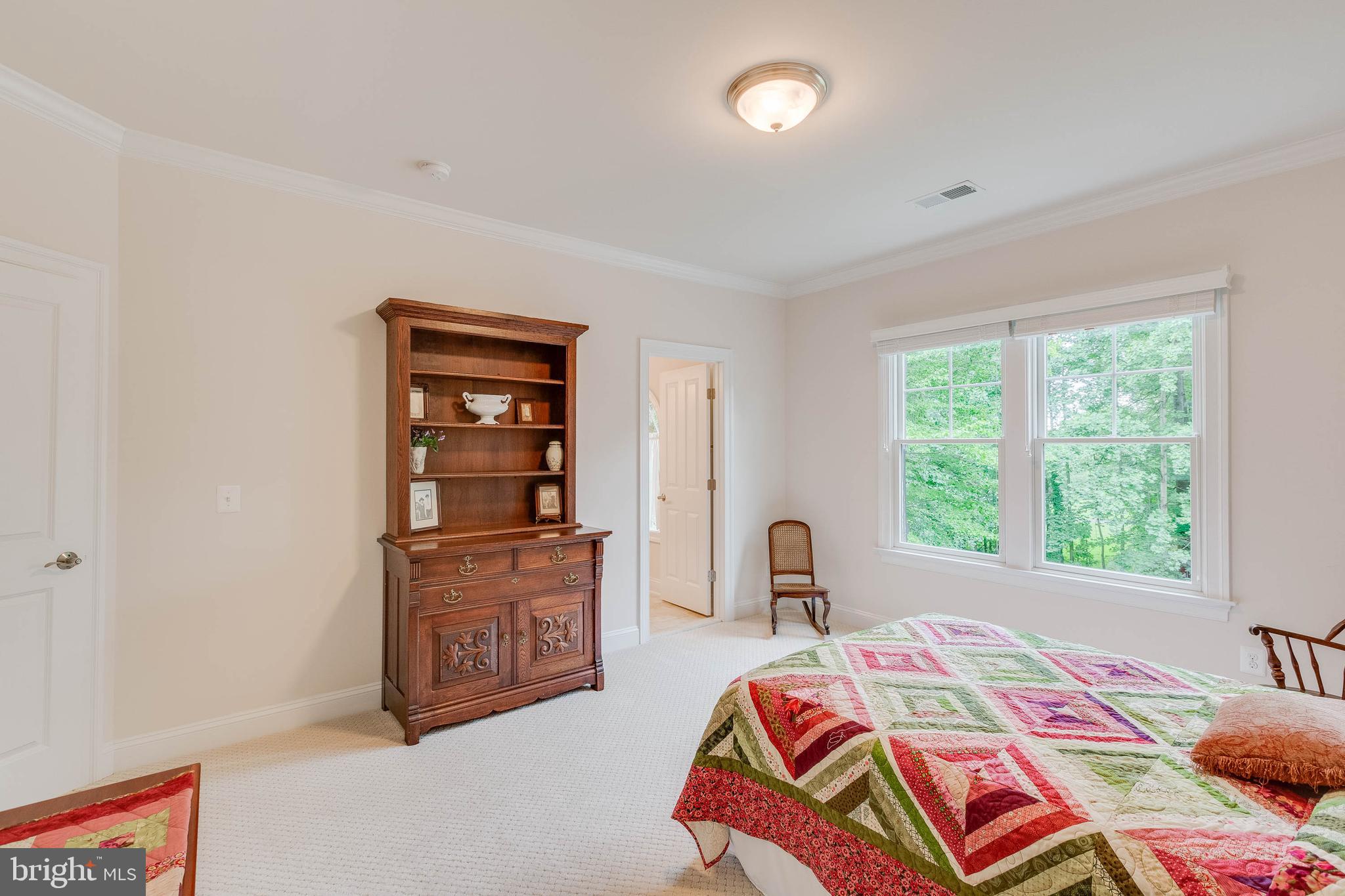 3003 Weber Place Oakton, VA 22124 - Photo 47 of 63 a bedroom with a bed a dresser and a large window