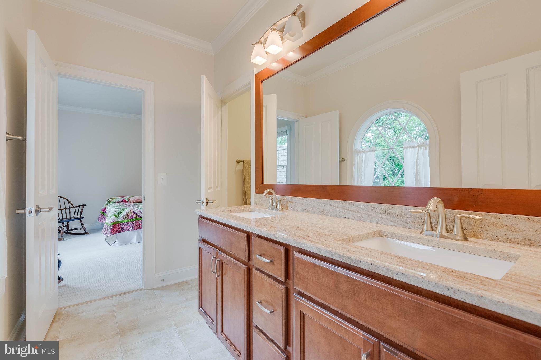 3003 Weber Place Oakton, VA 22124 - Photo 48 of 63 a bathroom with a granite countertop sink and a mirror