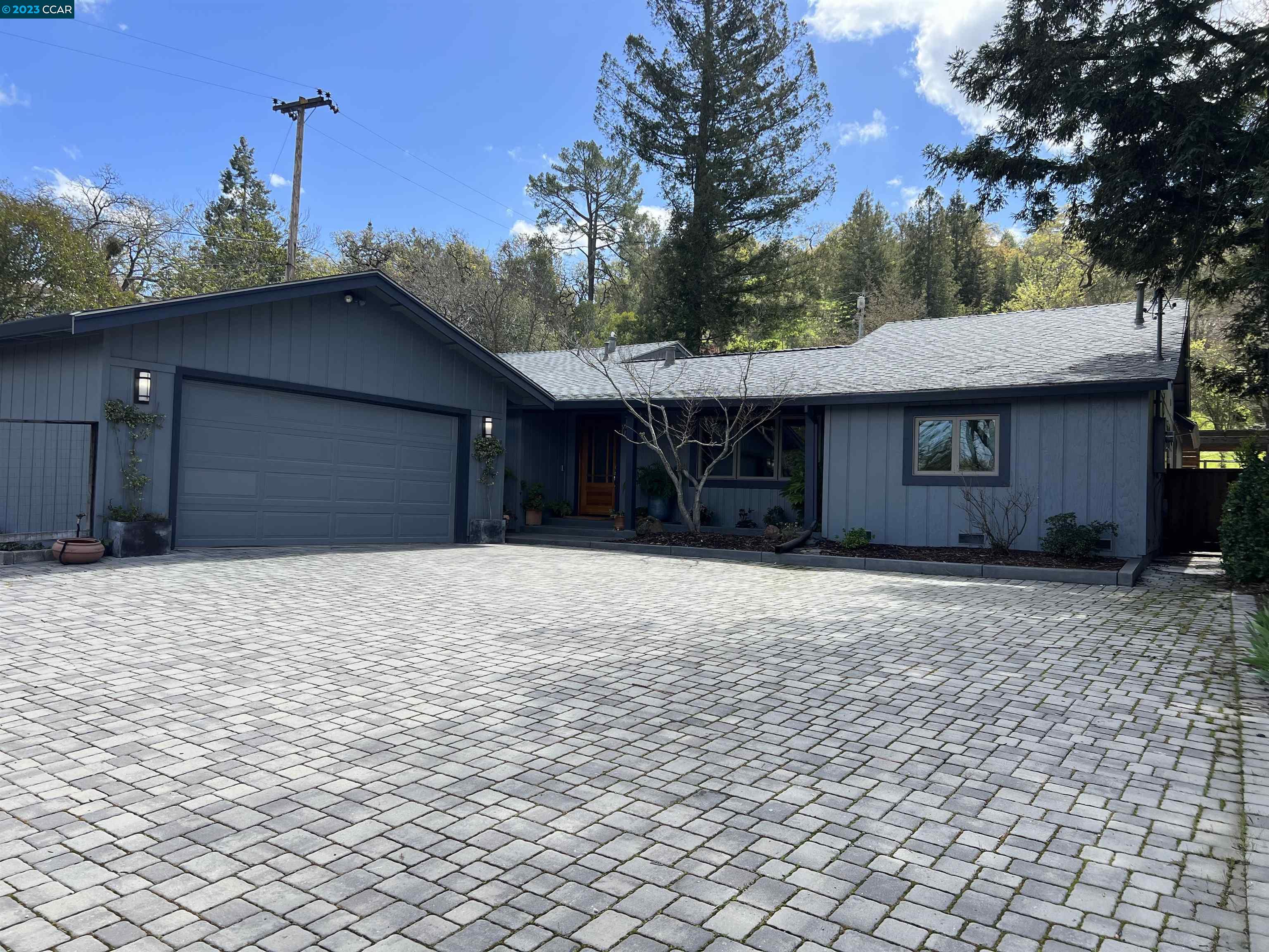 3425 St Marys Road Lafayette, CA 94549 - Photo 1 of 1 a front view of a house with a yard and garage