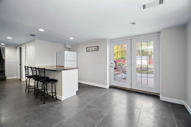 a view of a livingroom with furniture window and wooden floor