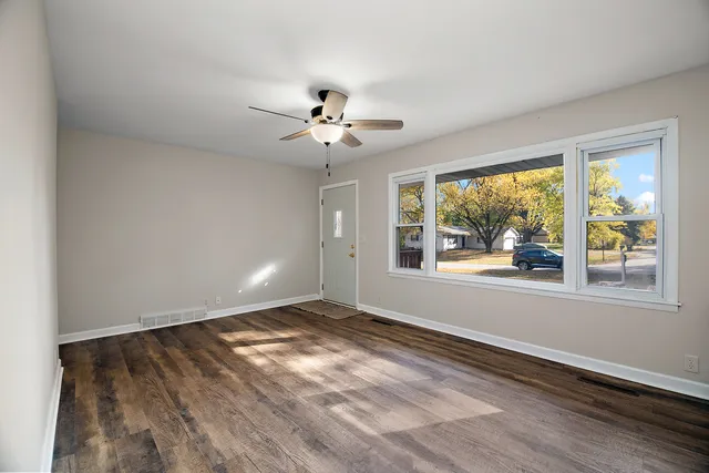 a view of an empty room with a window