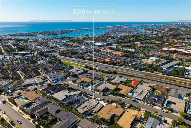 a view of a balcony with two chairs and a potted plant