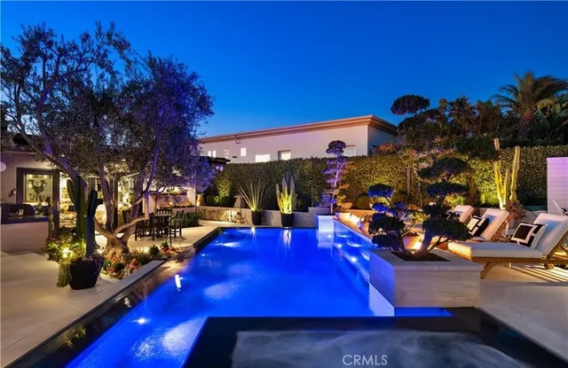 a view of a hallway with workspace and a couch