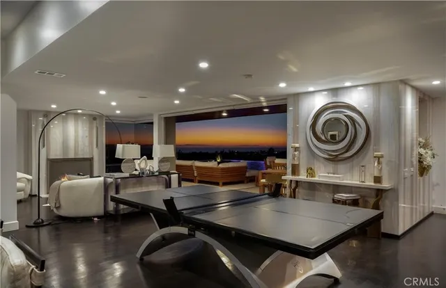 a large bedroom with a large bed and a large window