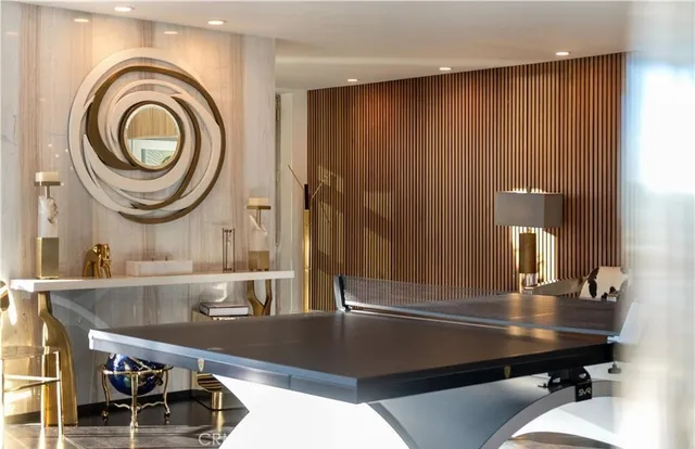 a large bed in a bedroom next to a window