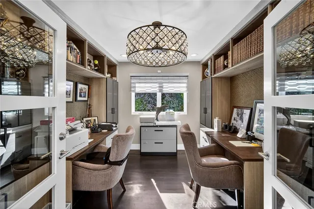 an aerial view of residential houses with city view