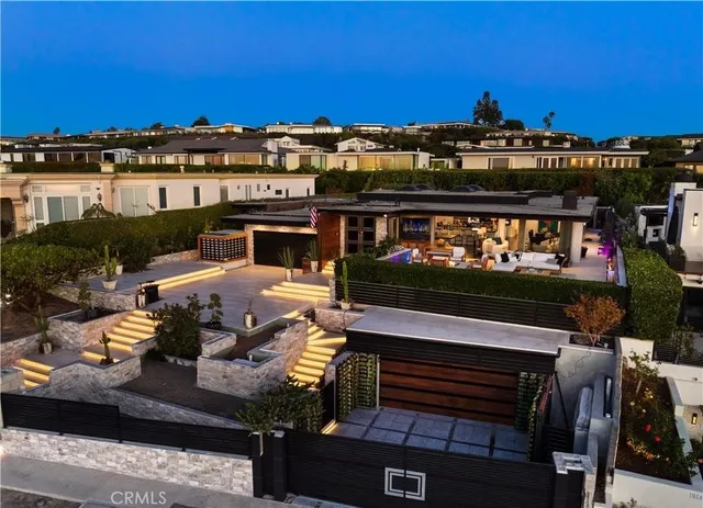 a view of swimming pool with seating space and city view