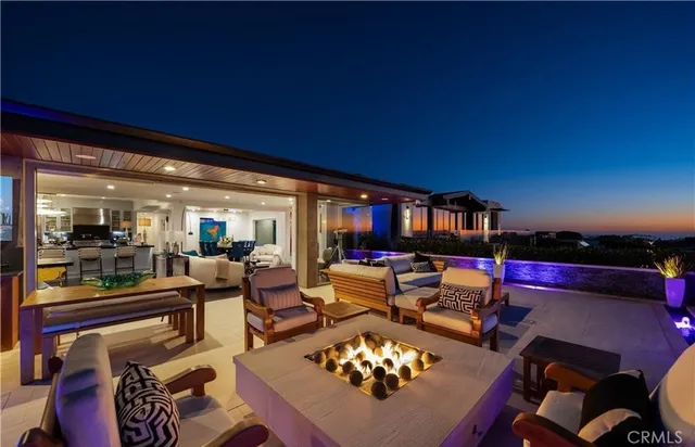 a living room with furniture hard wood floor and a flat screen tv
