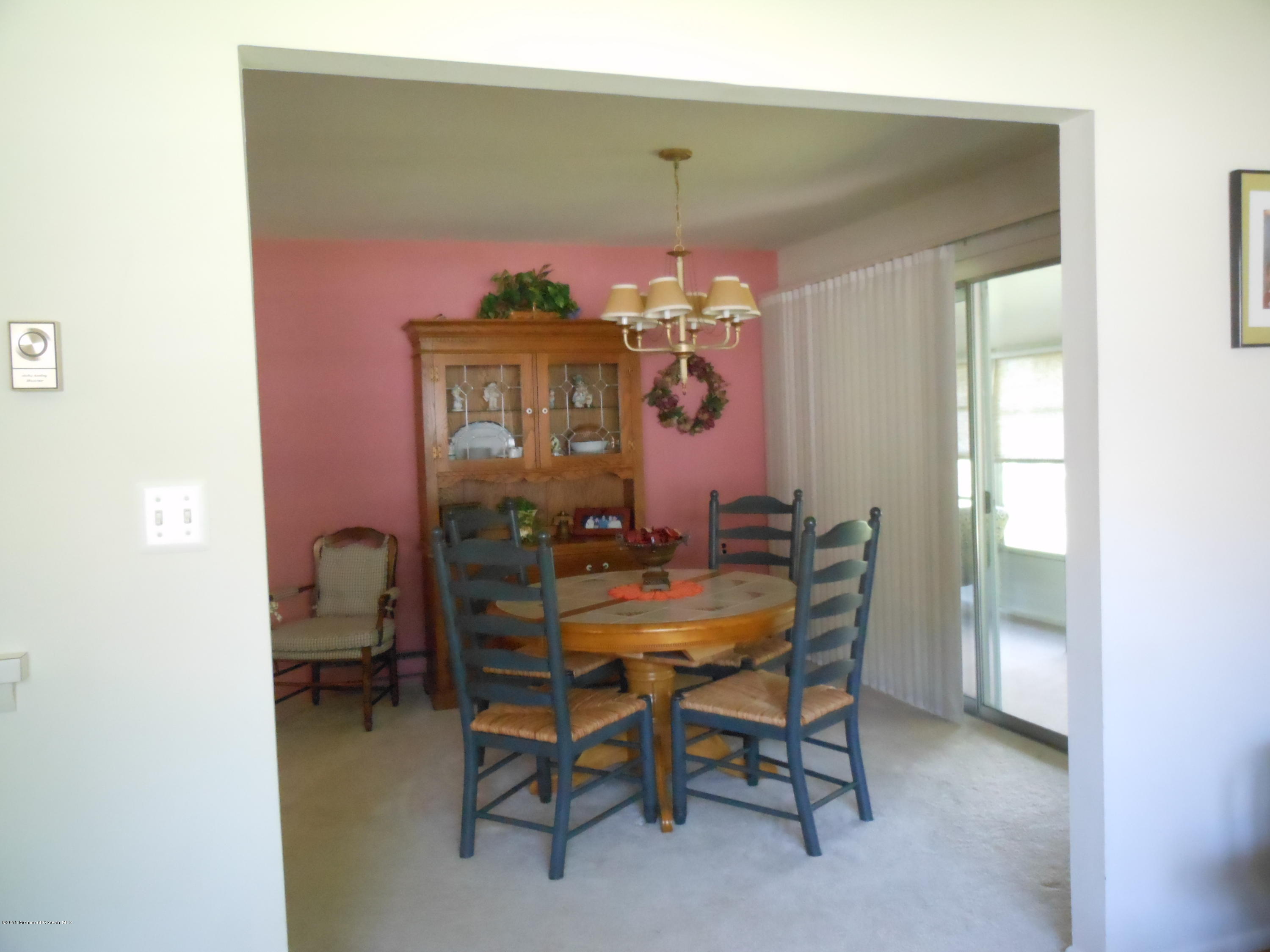 14 Phillips Road Brick, NJ 08724 - Photo 5 of 21 a view of a dining room with furniture and chandelier