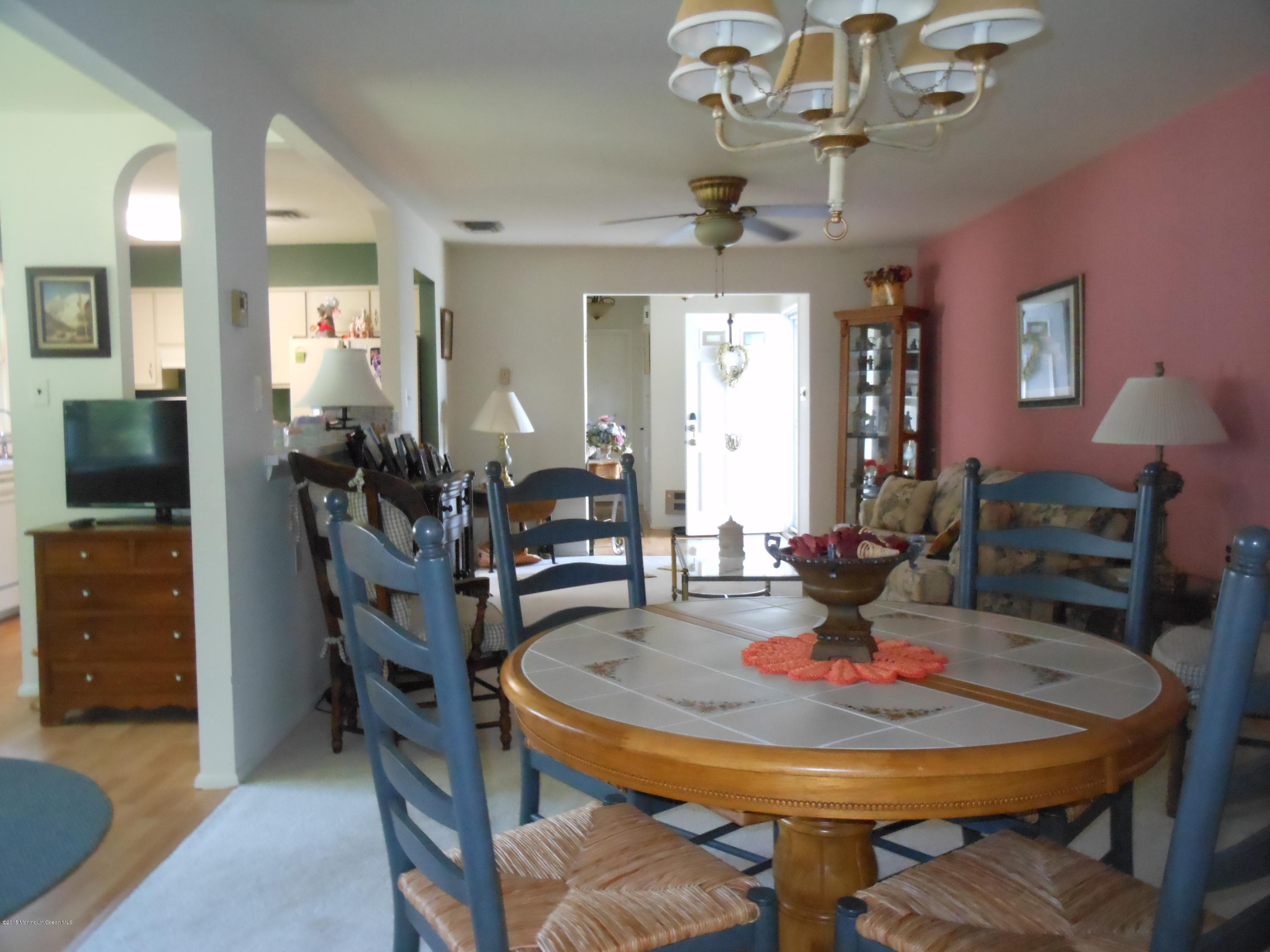 14 Phillips Road Brick, NJ 08724 - Photo 8 of 21 a view of a dining room with furniture and chandelier