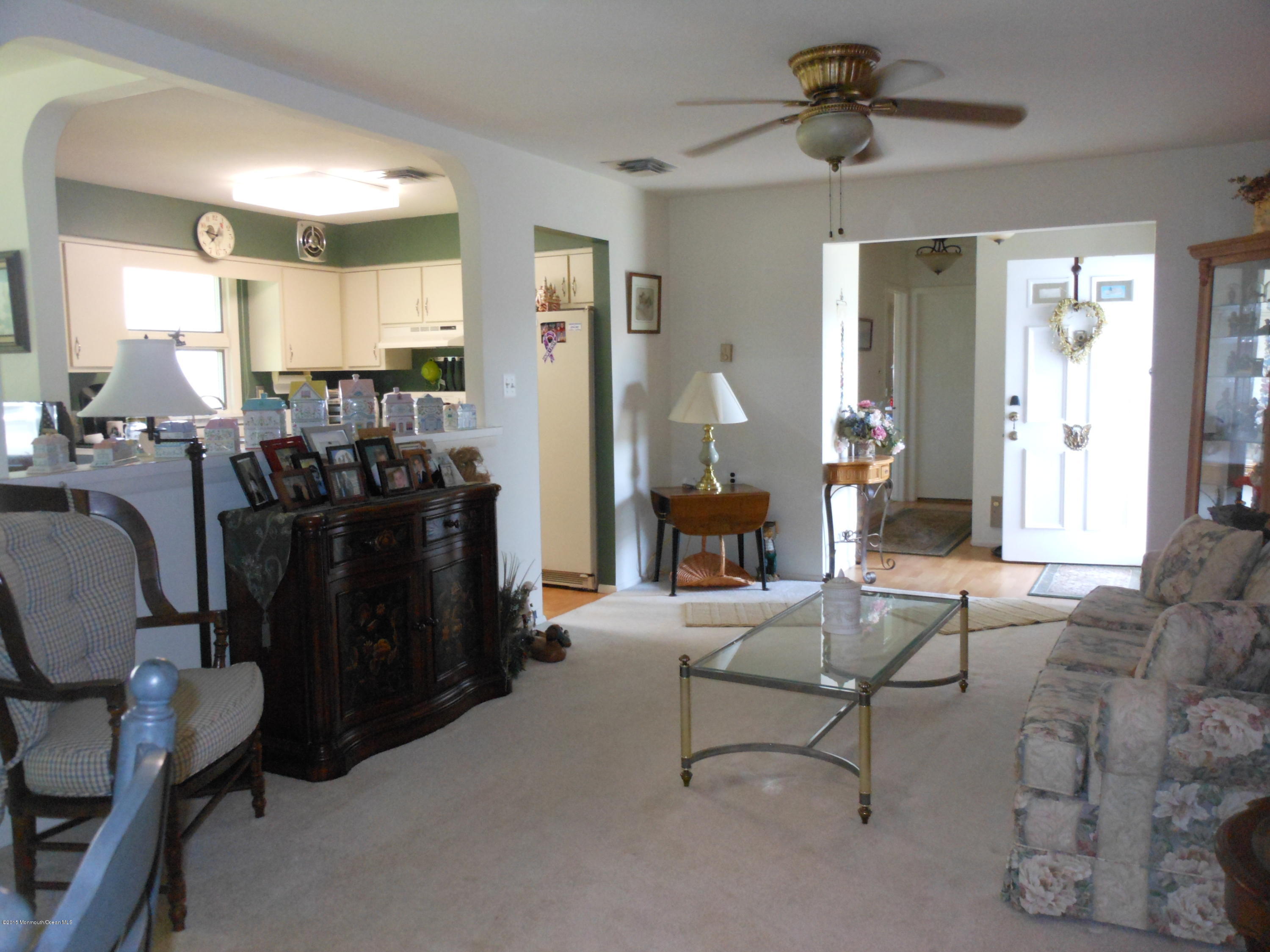 14 Phillips Road Brick, NJ 08724 - Photo 10 of 21 a living room with furniture and a chandelier