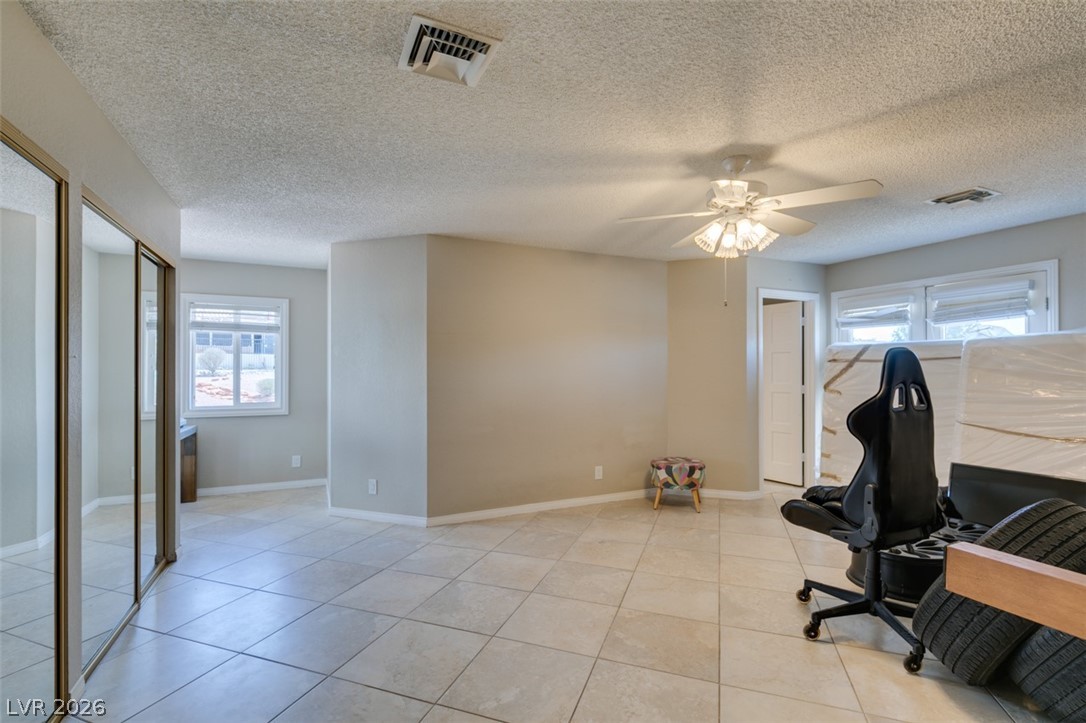 892 North Hollywood Boulevard Las Vegas, NV 89110 - Photo 38 of 81 Bright and airy bedroom with ample space and easy-to-maintain tile flooring.