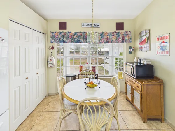 a kitchen with stainless steel appliances kitchen island granite countertop a sink and cabinets