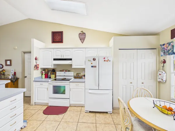 a kitchen with counter top space and appliances