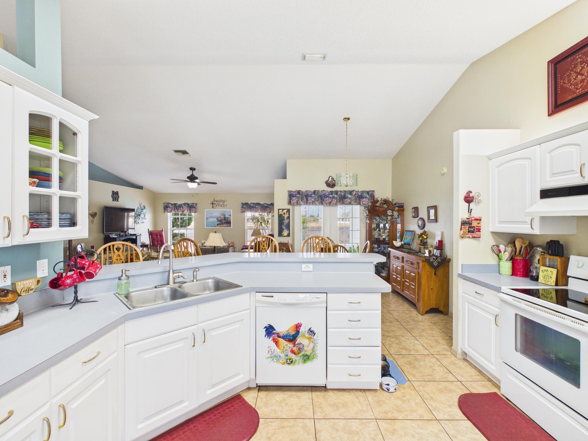 8525 Southwest 9th Street Okeechobee, FL 34974 - Photo 15 of 67 a kitchen with counter top space and appliances