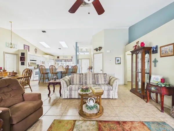 a living room with furniture and a dresser