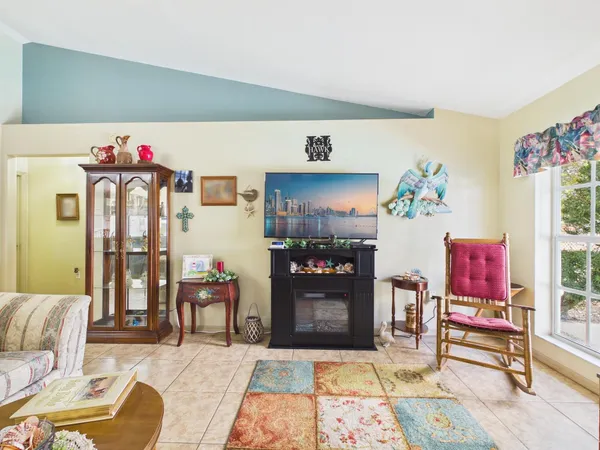a view of a hallway with paintings on the wall