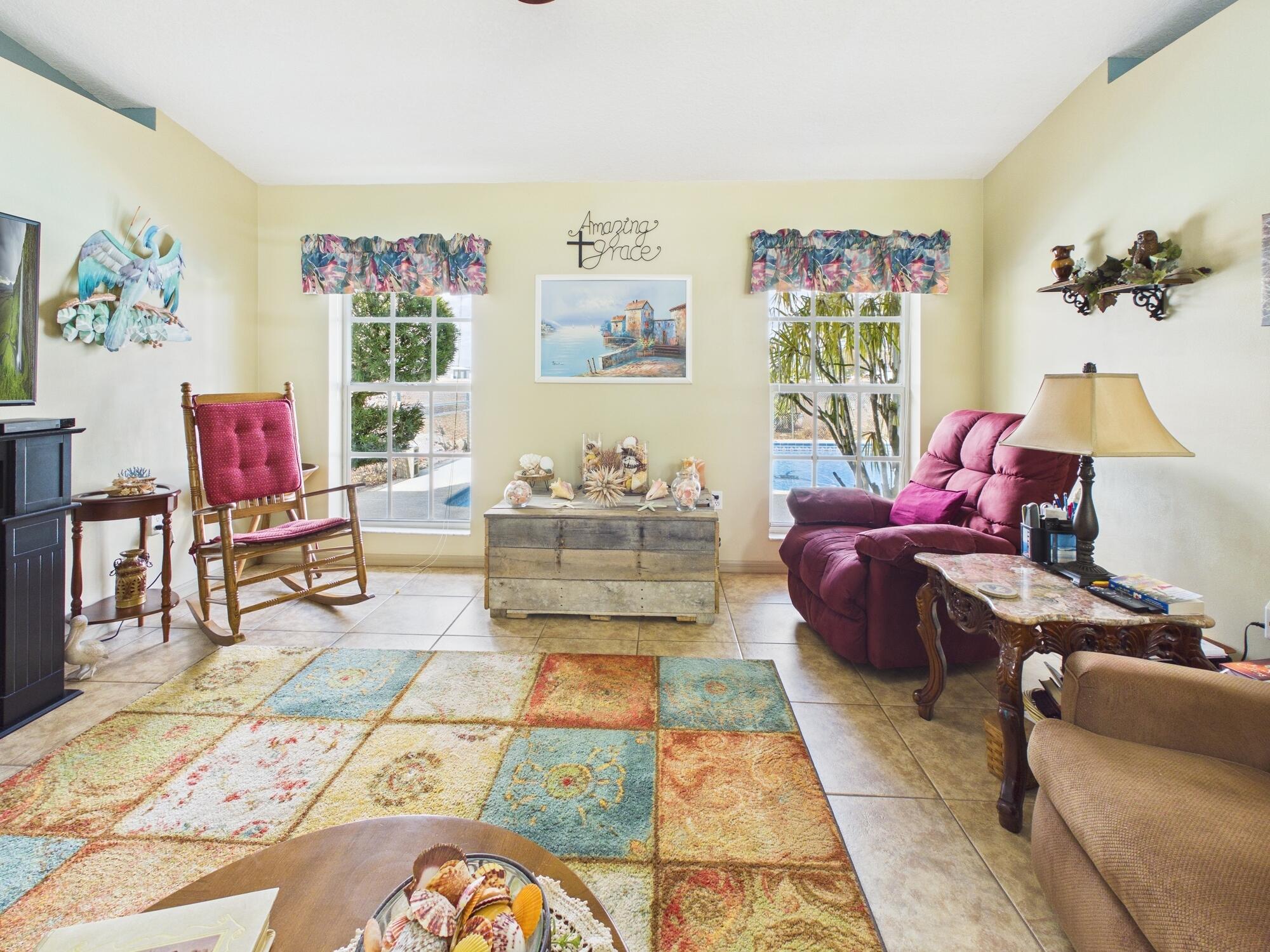 8525 Southwest 9th Street Okeechobee, FL 34974 - Photo 30 of 67 a living room with furniture and a rug