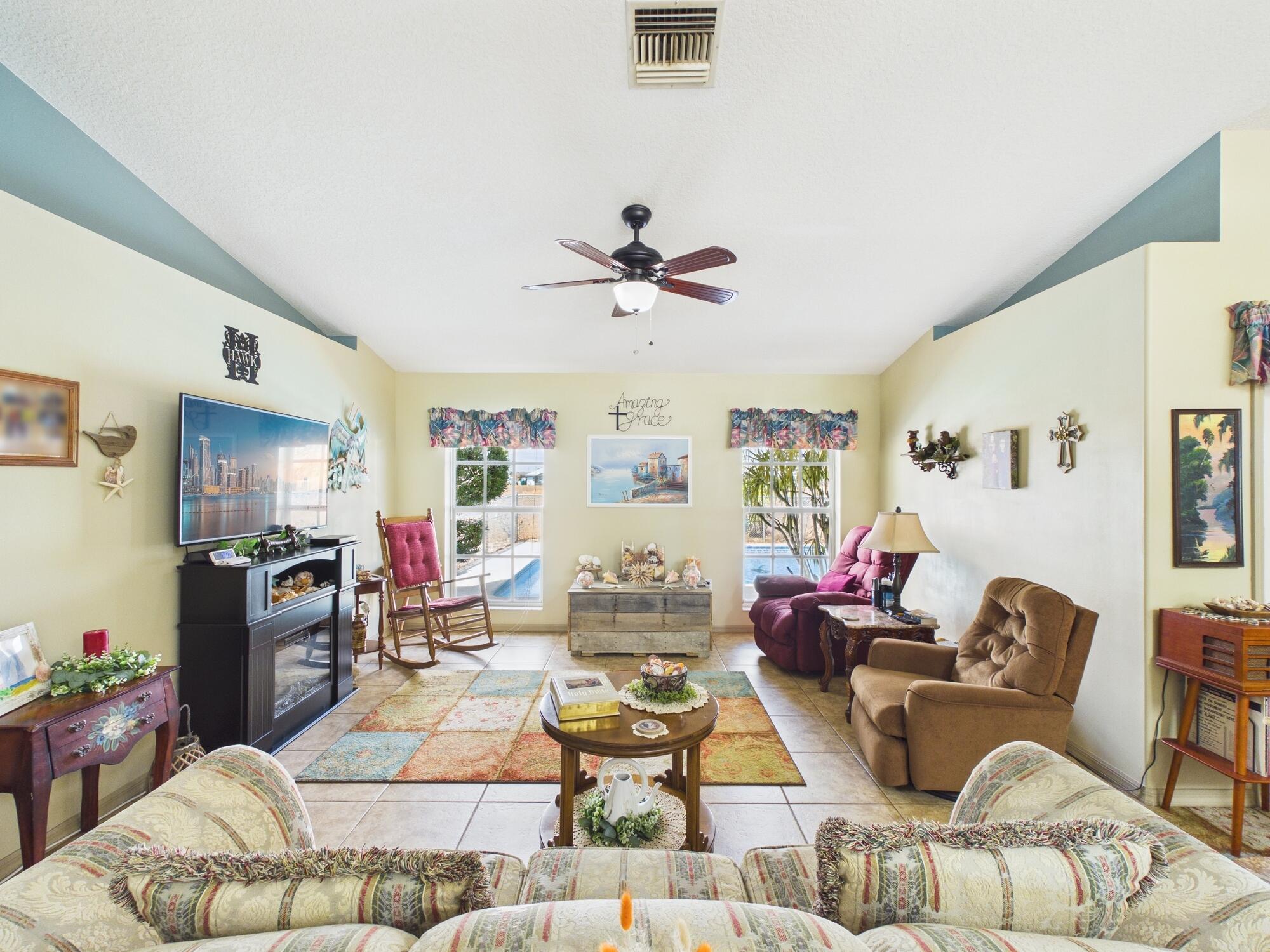 8525 Southwest 9th Street Okeechobee, FL 34974 - Photo 31 of 67 a living room with furniture and kitchen view