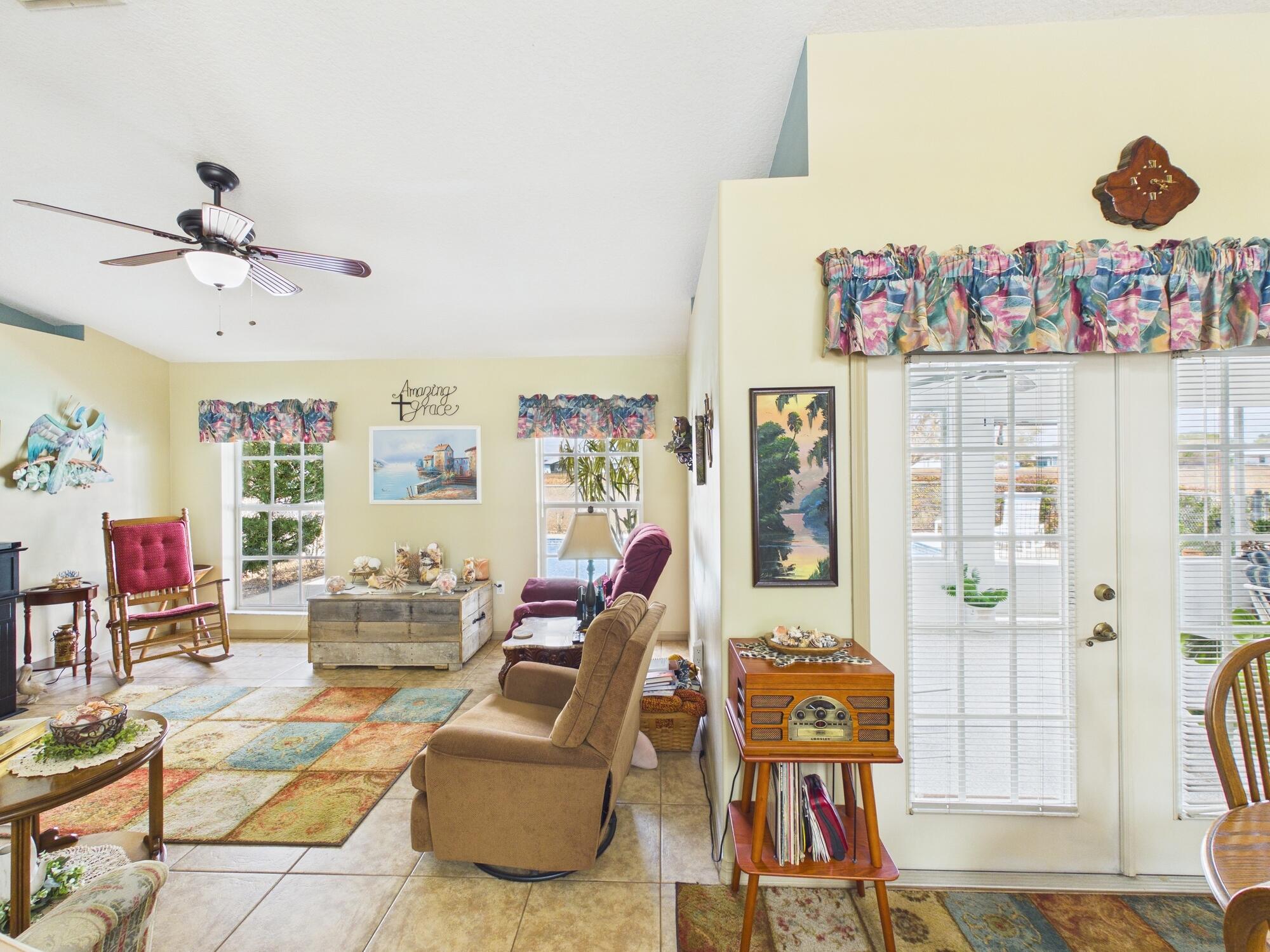 8525 Southwest 9th Street Okeechobee, FL 34974 - Photo 32 of 67 a living room with furniture and wooden floor