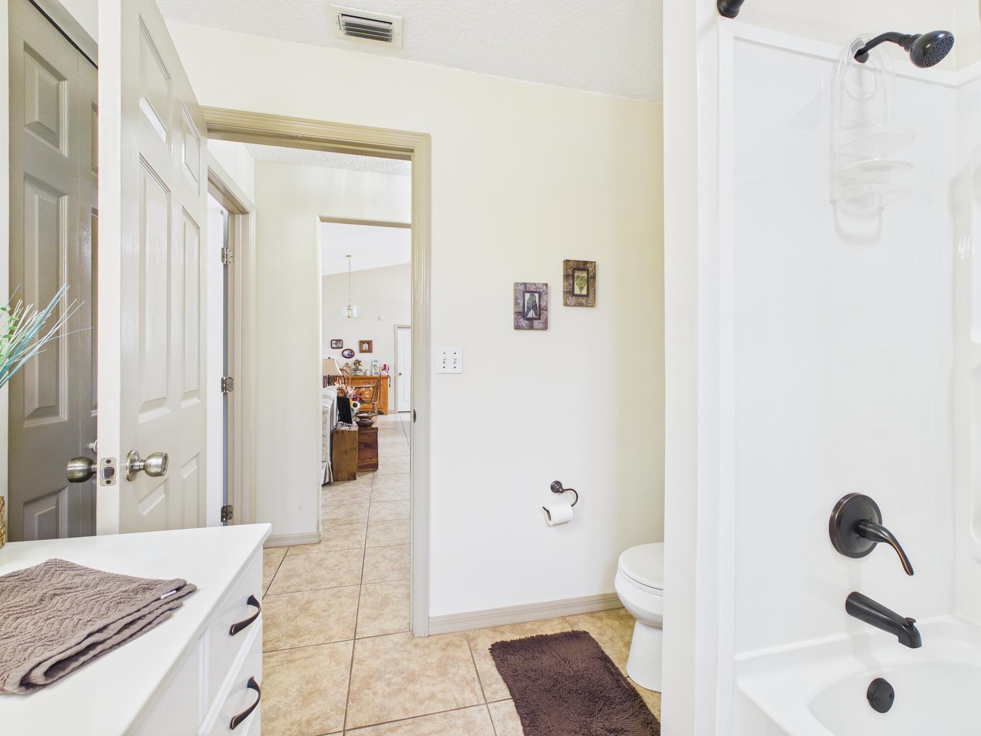 8525 Southwest 9th Street Okeechobee, FL 34974 - Photo 50 of 67 a bathroom with a sink a toilet and shower