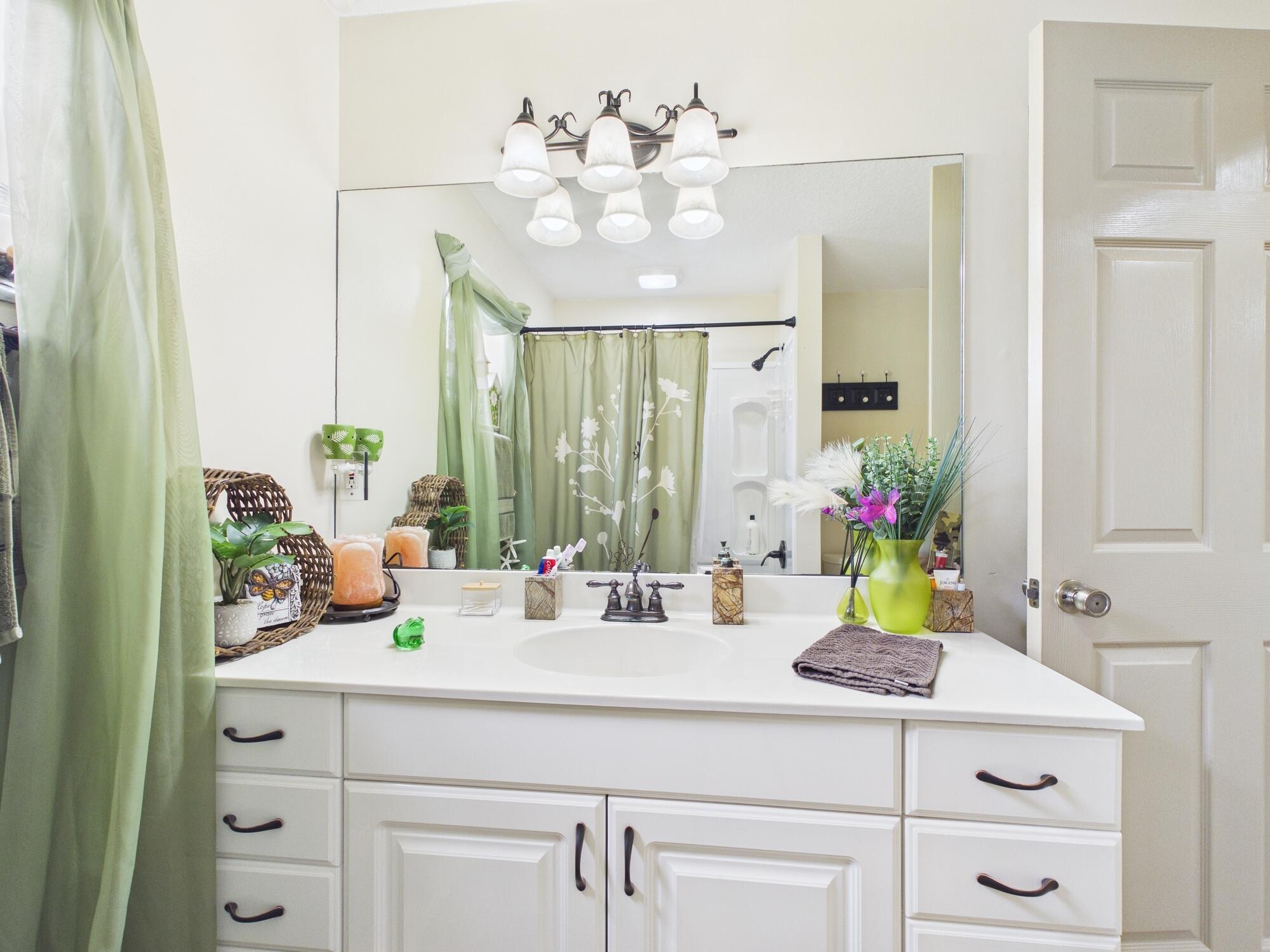 8525 Southwest 9th Street Okeechobee, FL 34974 - Photo 51 of 67 a bathroom with a sink double vanity and a mirror