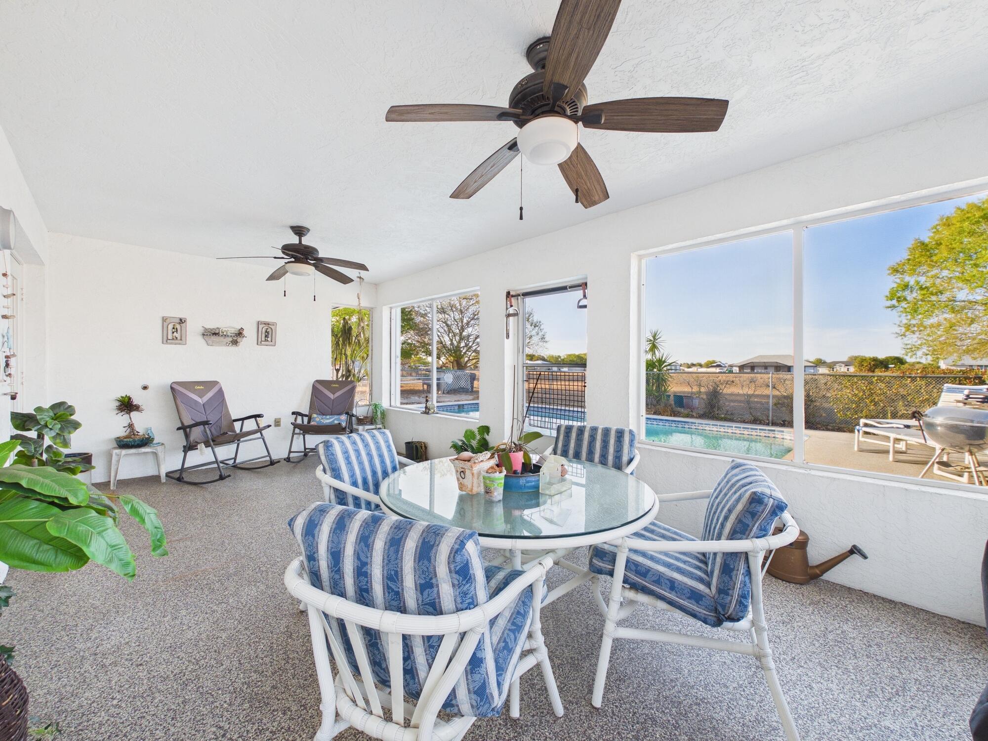8525 Southwest 9th Street Okeechobee, FL 34974 - Photo 63 of 67 a living room with furniture and a large window