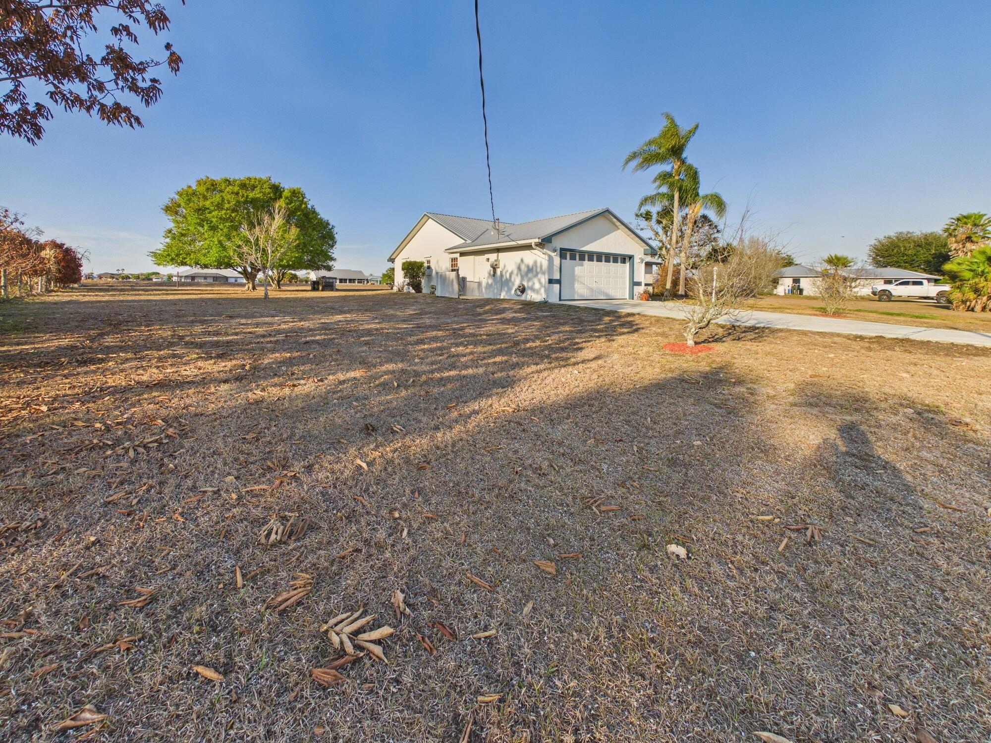 8525 Southwest 9th Street Okeechobee, FL 34974 - Photo 65 of 67 a house view with a outdoor space