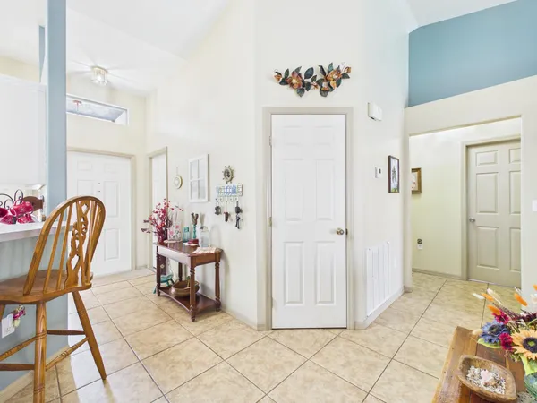 a kitchen with stainless steel appliances kitchen island granite countertop a refrigerator and a stove top oven