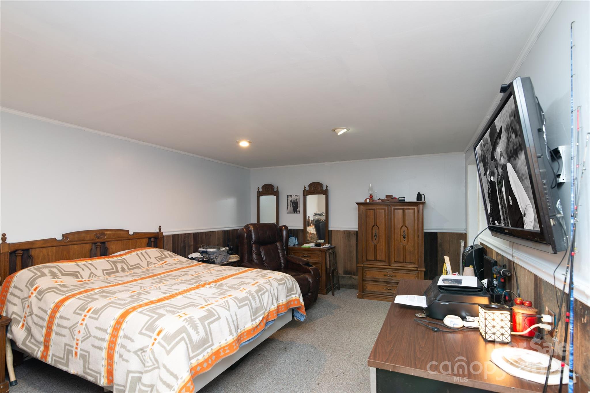220 Frosty Ridge Road Sylva, NC 28779 - Photo 16 of 32 a bedroom with a bed and walk in closet