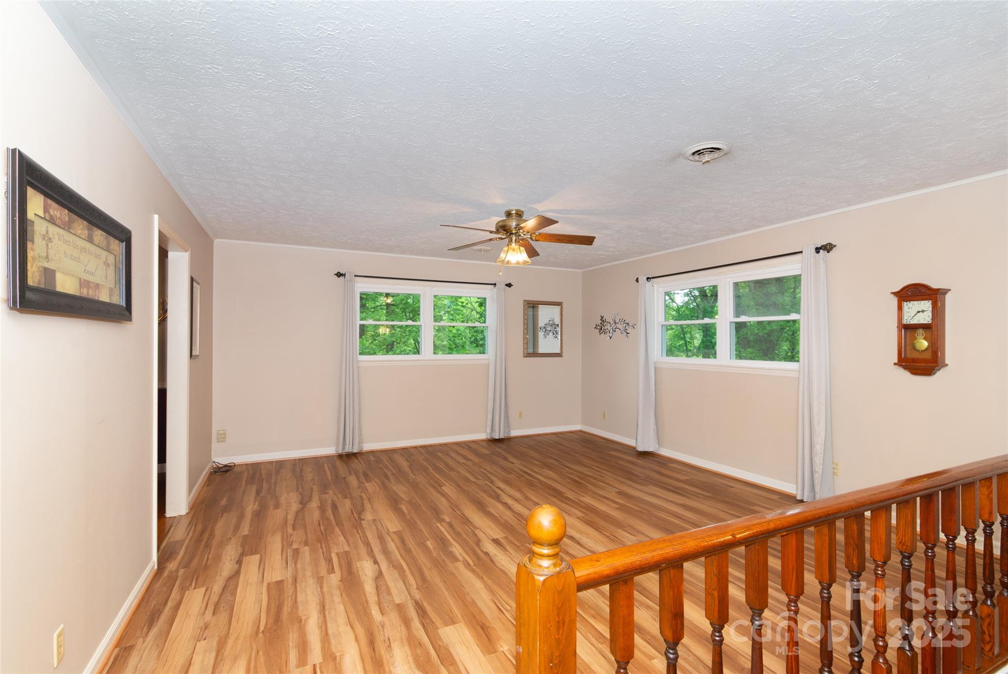 220 Frosty Ridge Road Sylva, NC 28779 - Photo 3 of 32 a view of a room with wooden floor and a window