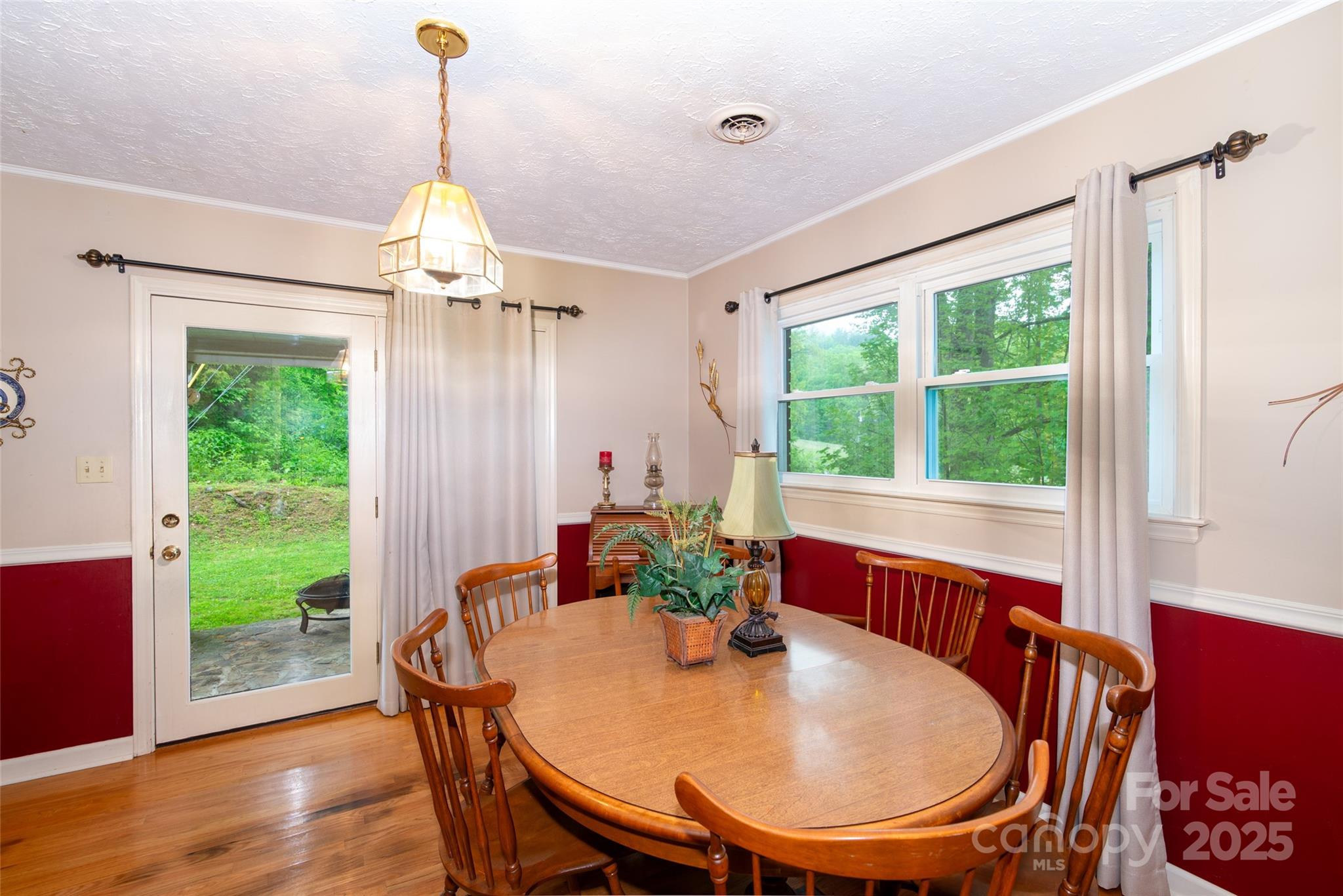 220 Frosty Ridge Road Sylva, NC 28779 - Photo 4 of 32 a view of a dining room with furniture window and wooden floor