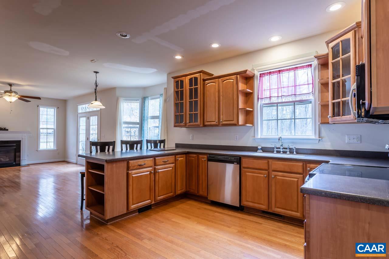 25 Haversack Road Palmyra, VA 22963 - Photo 12 of 42 a kitchen with stainless steel appliances granite countertop a sink dishwasher a stove and a refrigerator